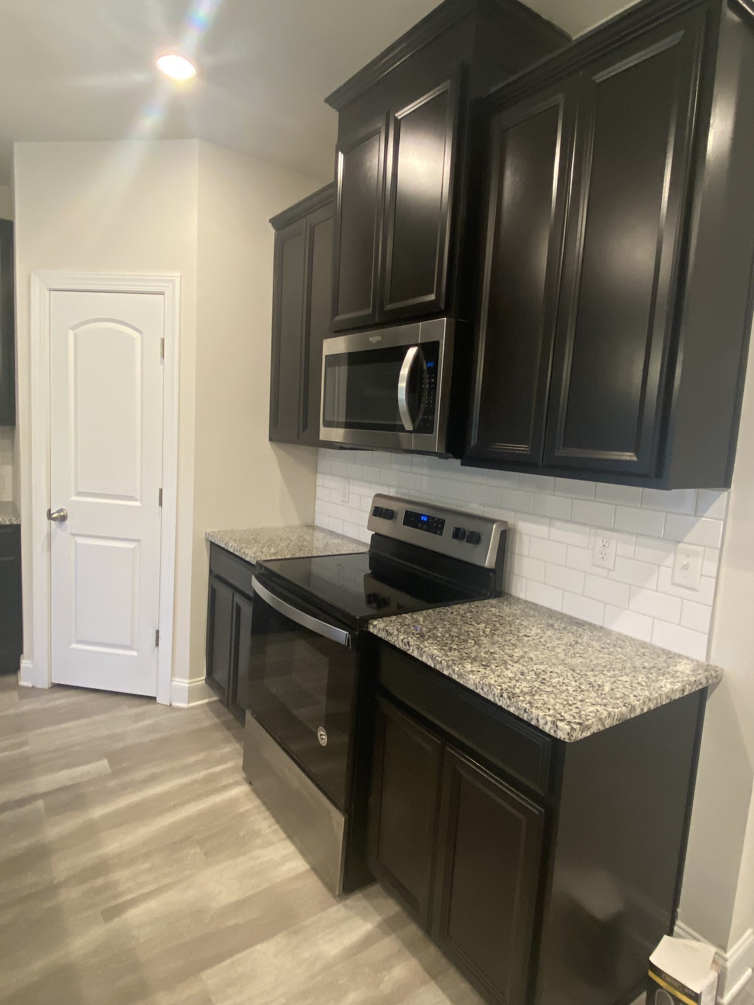 1364 Vilda Way Lebanon, TN 37087 - Photo 5 of 18 a kitchen with stainless steel appliances granite countertop a sink stove and cabinets