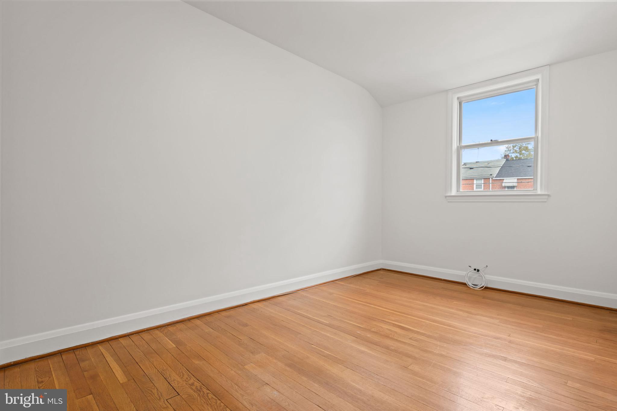 1616 Hardwick Road Towson, MD 21286 - Photo 11 of 53 a view of an empty room with wooden floor and a window
