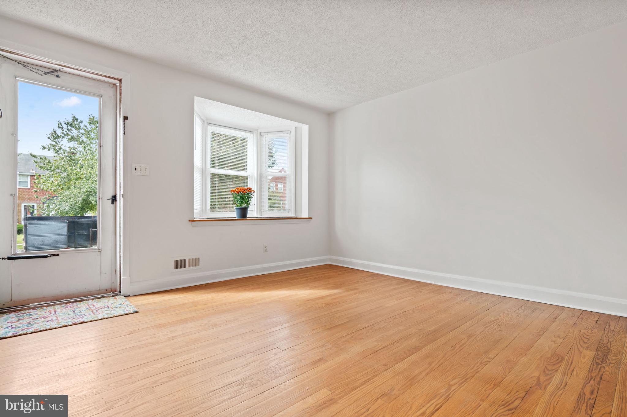 1616 Hardwick Road Towson, MD 21286 - Photo 14 of 53 an empty room with wooden floor and windows