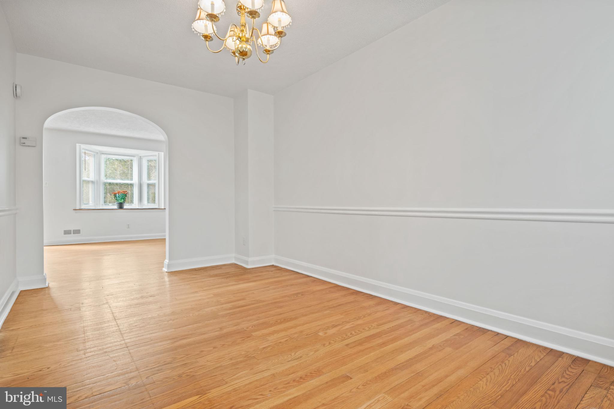 1616 Hardwick Road Towson, MD 21286 - Photo 19 of 53 wooden floor in an empty room with a window