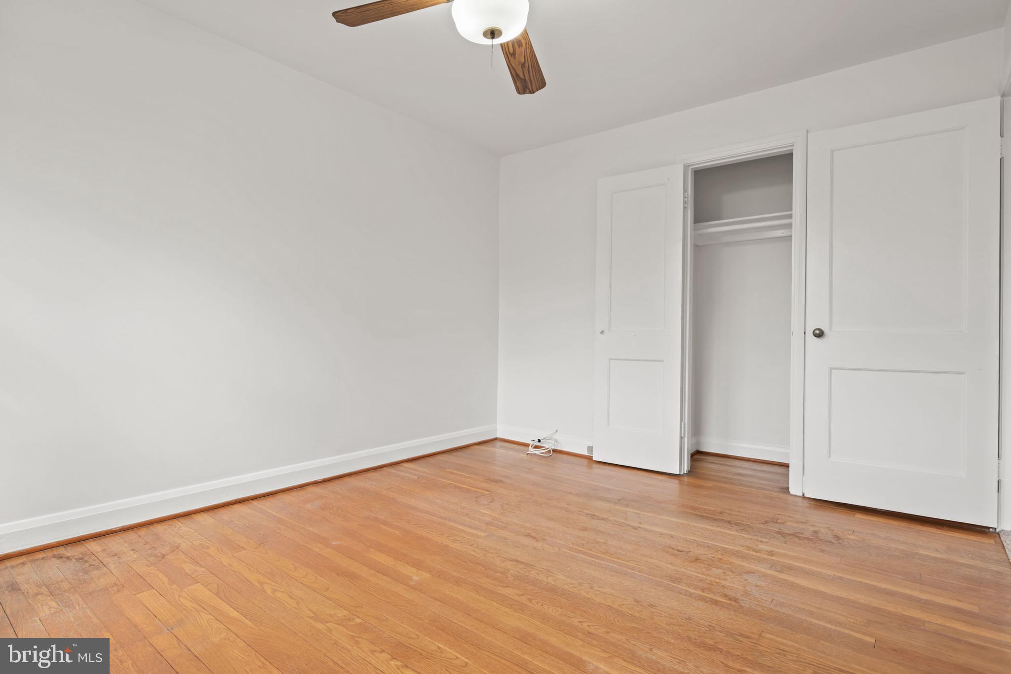 1616 Hardwick Road Towson, MD 21286 - Photo 26 of 53 an empty room with wooden floor and windows