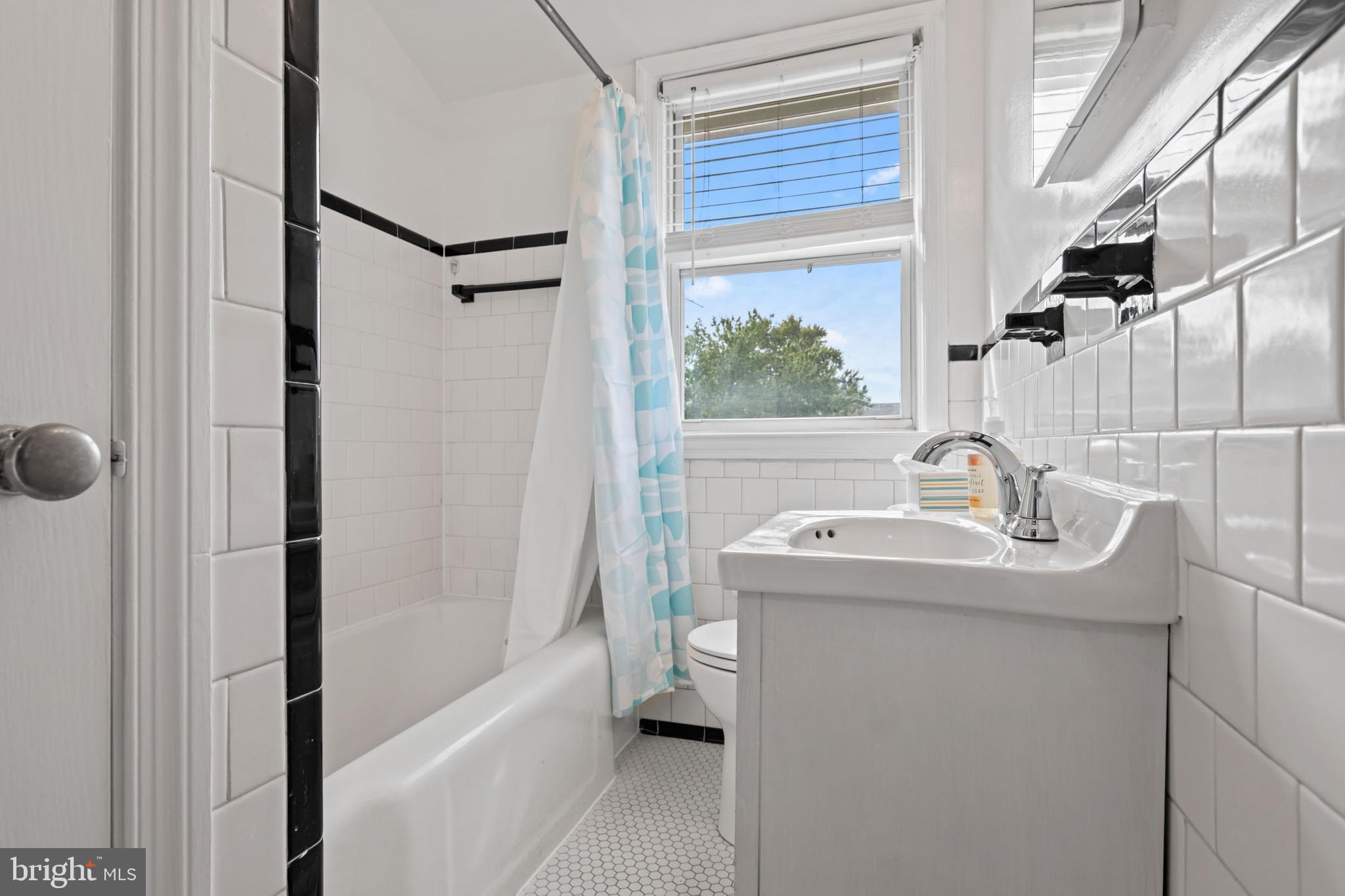 1616 Hardwick Road Towson, MD 21286 - Photo 27 of 53 a bathroom with a sink a toilet and shower