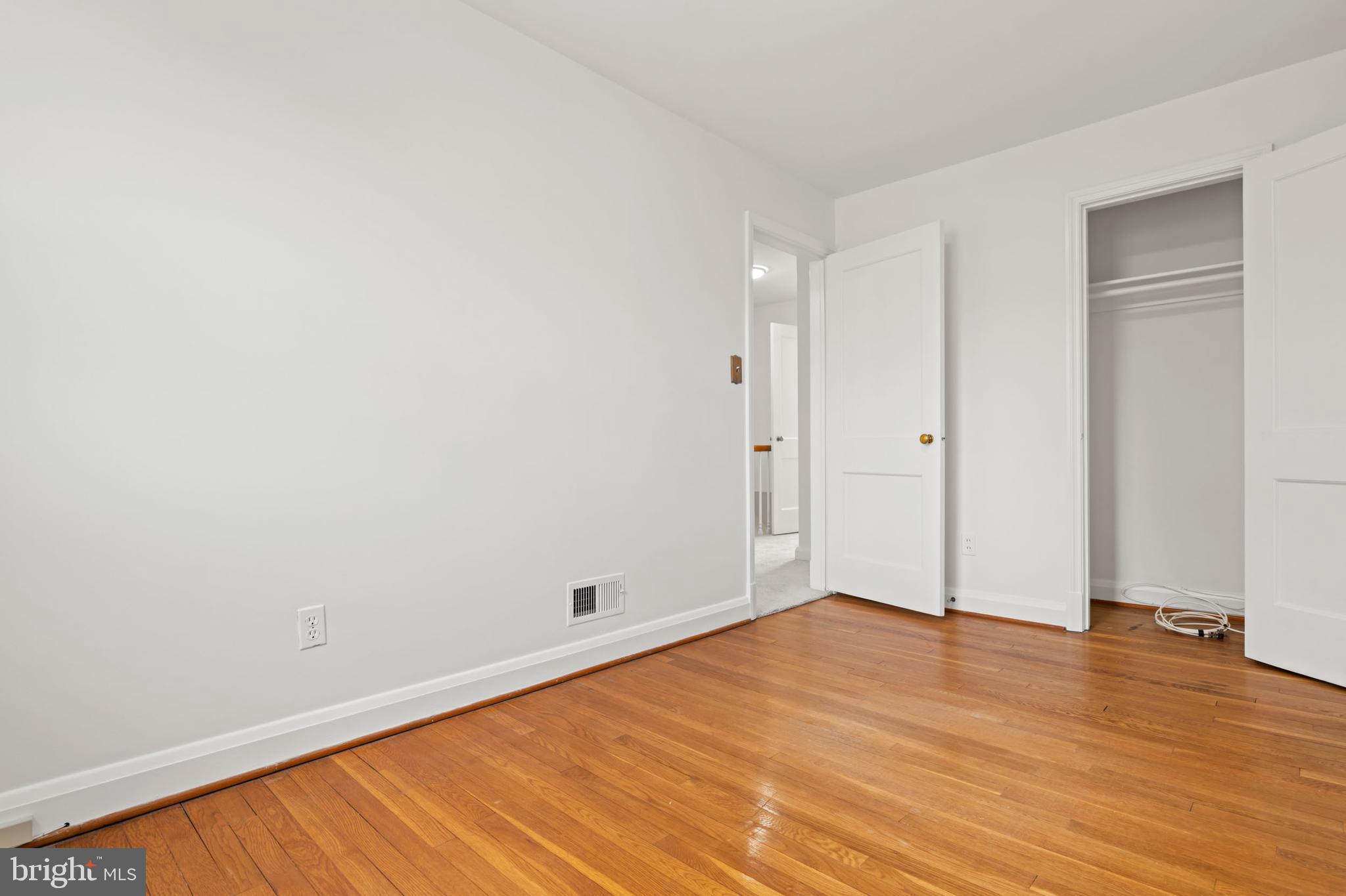 1616 Hardwick Road Towson, MD 21286 - Photo 30 of 53 an empty room with wooden floor