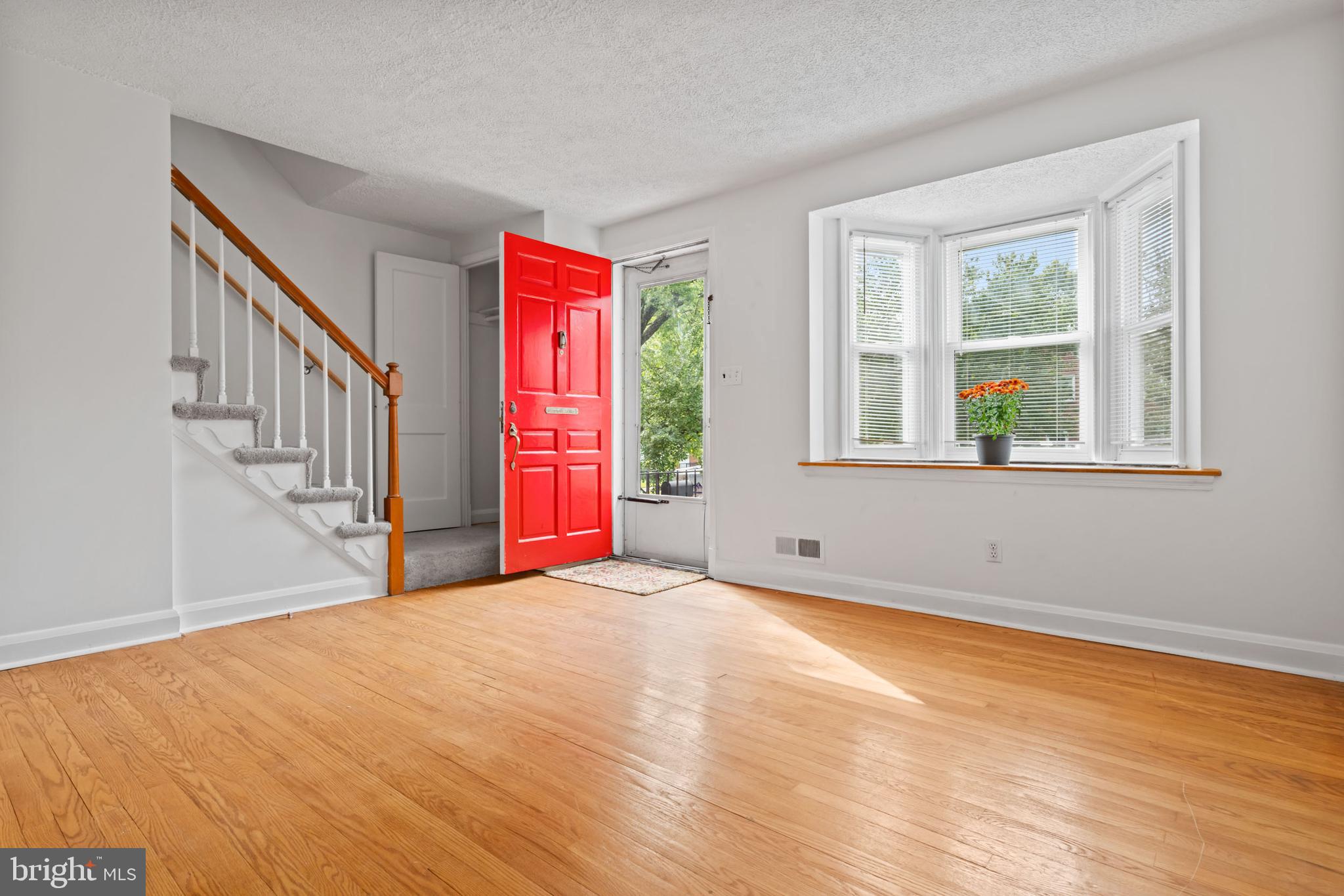1616 Hardwick Road Towson, MD 21286 - Photo 5 of 53 a view of an empty room with wooden floor and a window