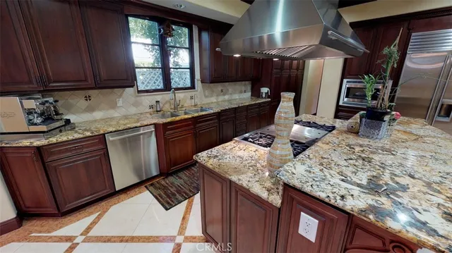 a kitchen with sink cabinets and window
