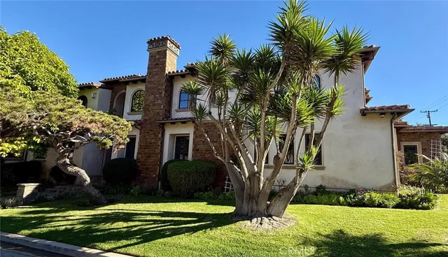 a front view of a house with yard