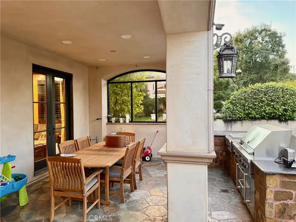 a outdoor dining space with furniture and outdoor view