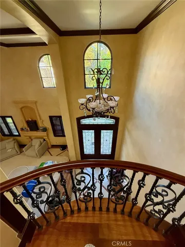 a view of a entryway door with wooden floor