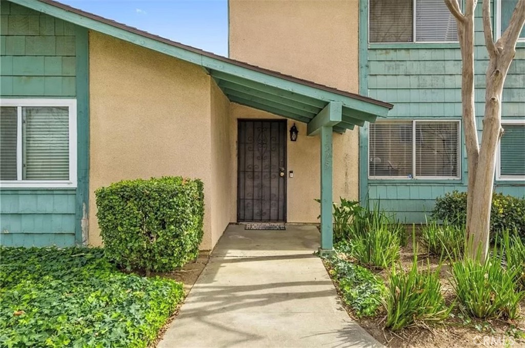 1375 Wheaton Way Riverside, CA 92507 - Photo 1 of 15 a front view of a house with a garden