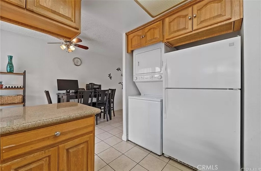 1375 Wheaton Way Riverside, CA 92507 - Photo 5 of 15 a kitchen view with a refrigerator a stove and cabinets