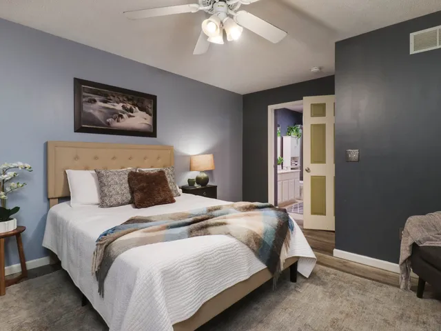 a bedroom with bed and a window