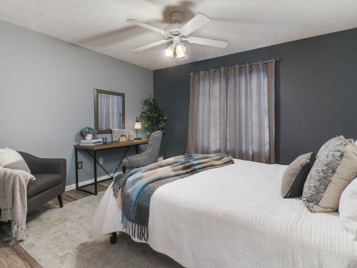 109 Sandra Court Normal, IL 61761 - Photo 13 of 35 a bedroom with a bed and a chandelier