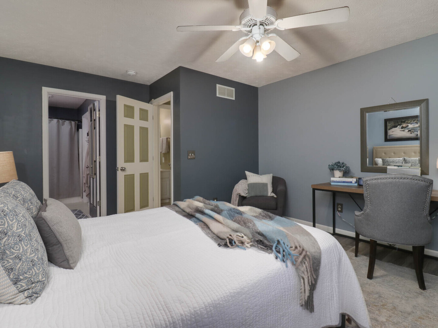 109 Sandra Court Normal, IL 61761 - Photo 15 of 35 a bedroom with a bed and a chandelier