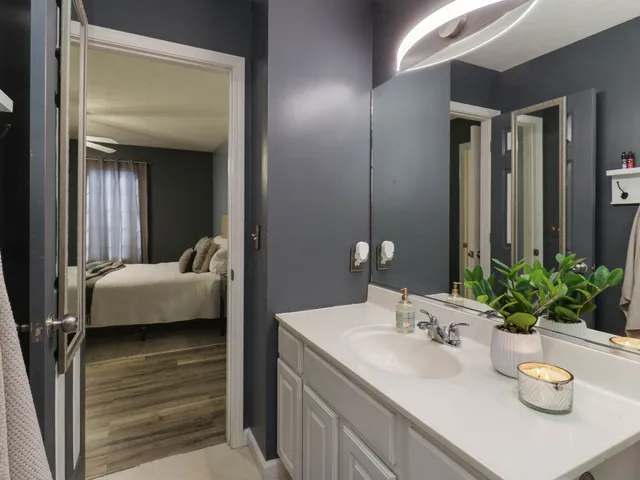 a bathroom with a sink a faucet and a mirror