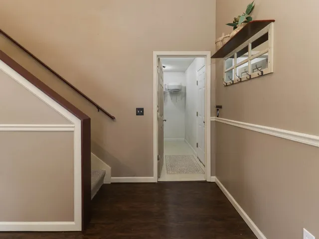 an empty room with wooden floor