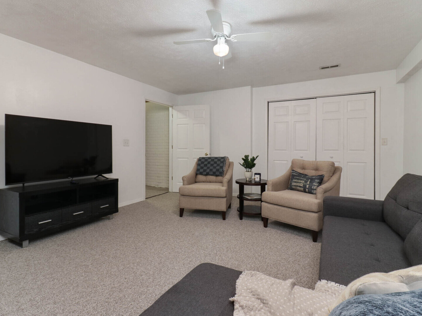 109 Sandra Court Normal, IL 61761 - Photo 29 of 35 a living room with furniture and a flat screen tv