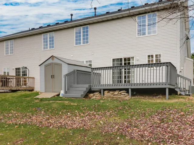 a white house with a sink and garden