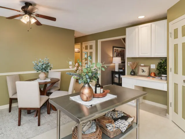 a dining room with furniture and window