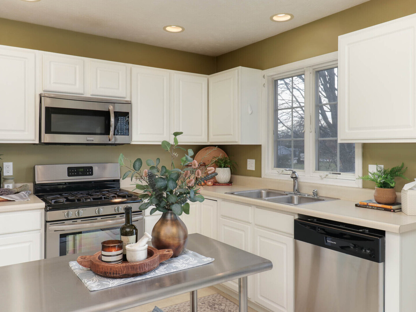 109 Sandra Court Normal, IL 61761 - Photo 8 of 35 a kitchen with a stove a sink and a microwave