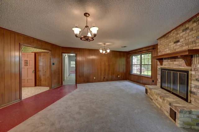 a view of a hallway with chandelier