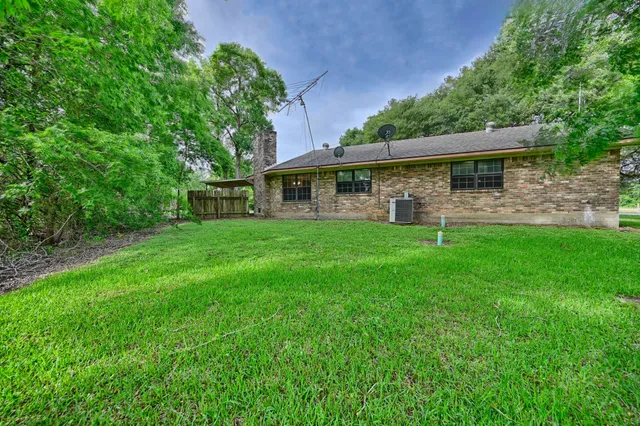 a view of a house with a yard porch and sitting area