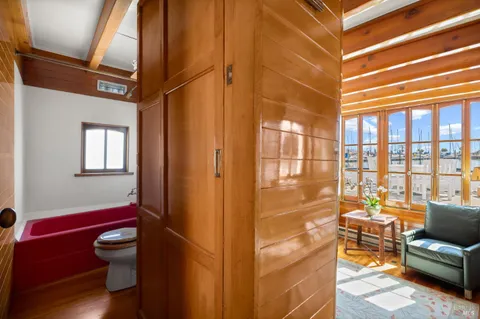 a view of a patio with table and chairs with wooden floor