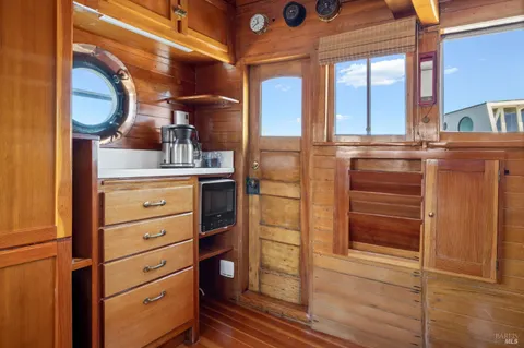 a kitchen with a stove and a window