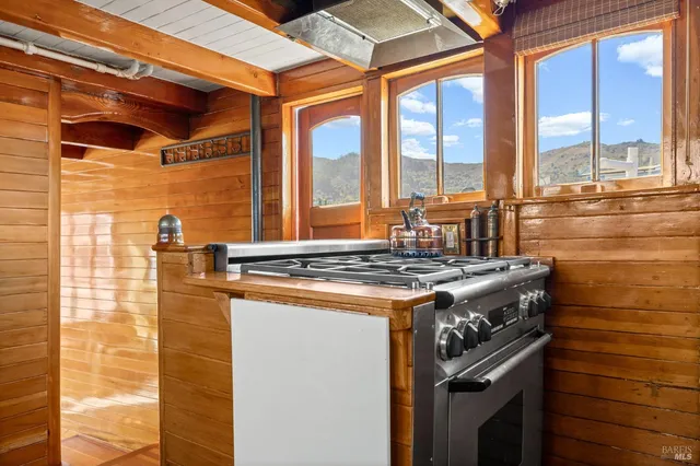 a view of a balcony with table and chairs