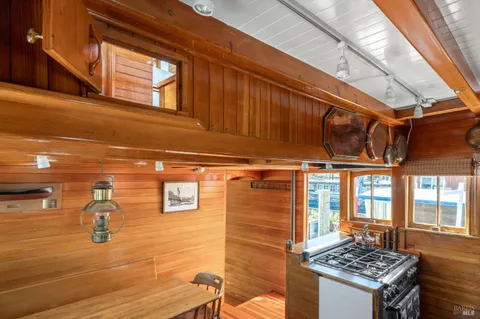 a large bed sitting in a bedroom next to a window