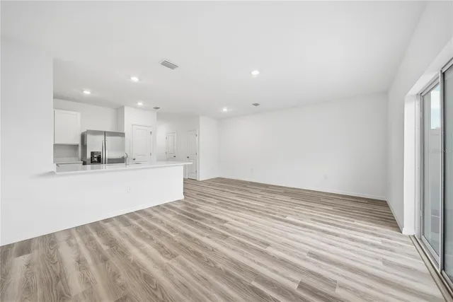 a view of kitchen with wooden floor