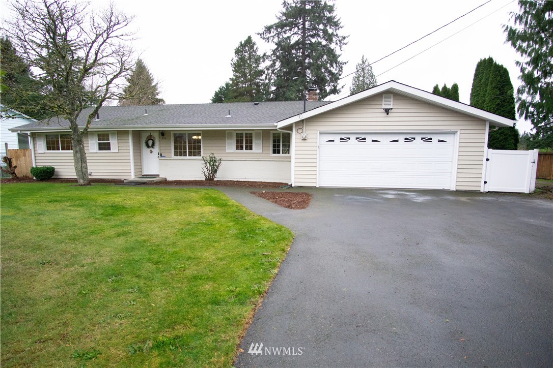 306 216th Street Southwest Bothell, WA 98021 - Photo 1 of 31 a view of a house with a yard and large tree