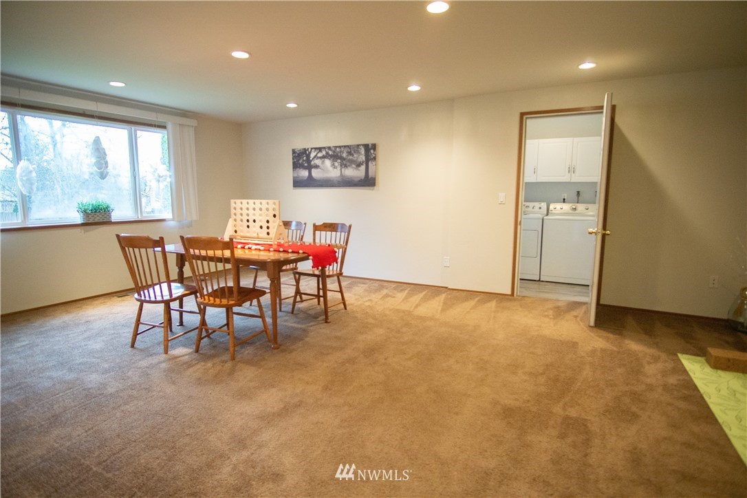 306 216th Street Southwest Bothell, WA 98021 - Photo 12 of 31 a view of a room with furniture and a large window