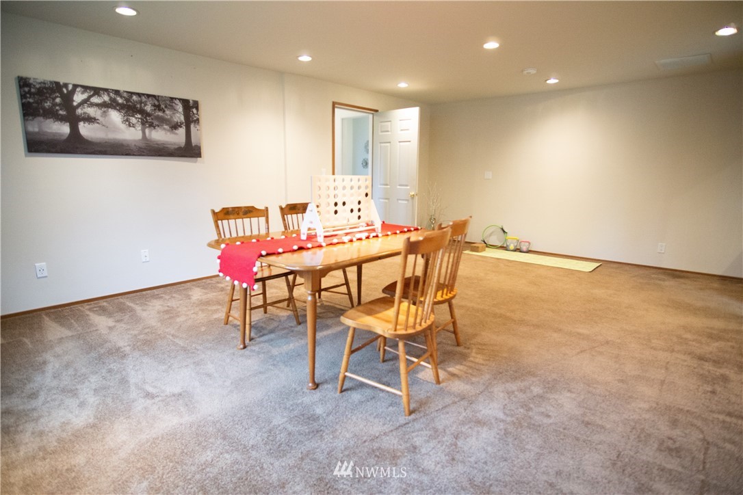 306 216th Street Southwest Bothell, WA 98021 - Photo 13 of 31 a dining room with a table and chairs