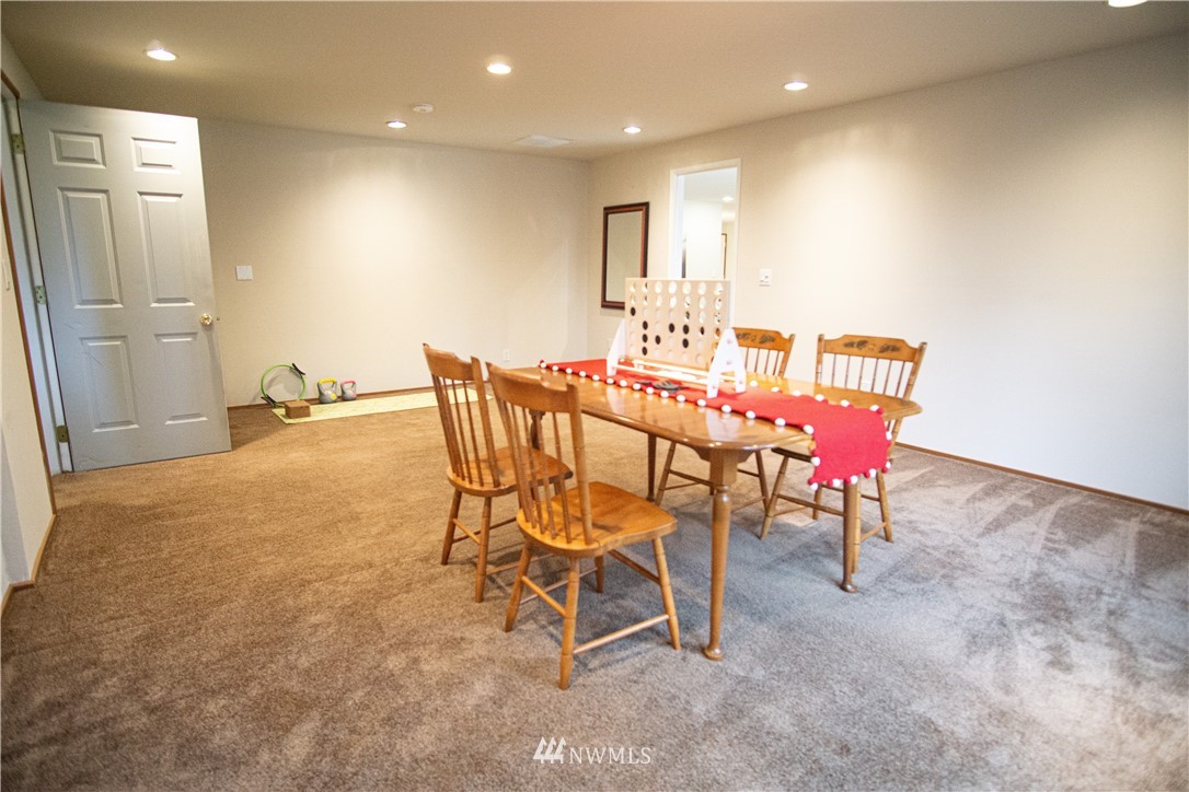306 216th Street Southwest Bothell, WA 98021 - Photo 14 of 31 a dining room with furniture and a window