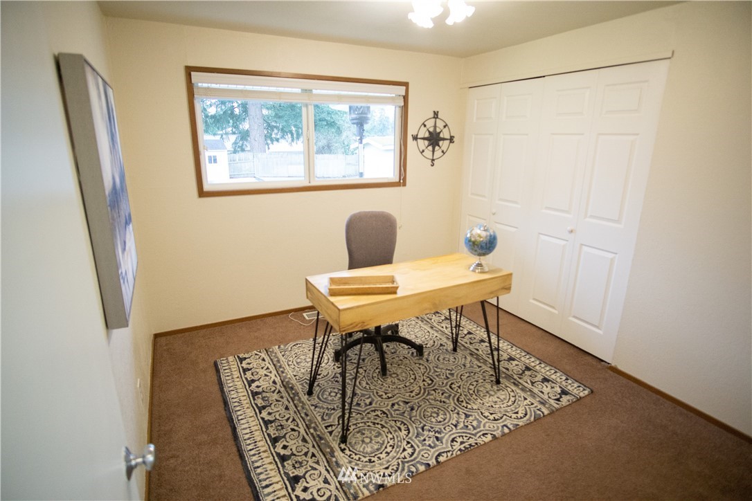 306 216th Street Southwest Bothell, WA 98021 - Photo 22 of 31 a view of a workspace area with furniture and wooden floor