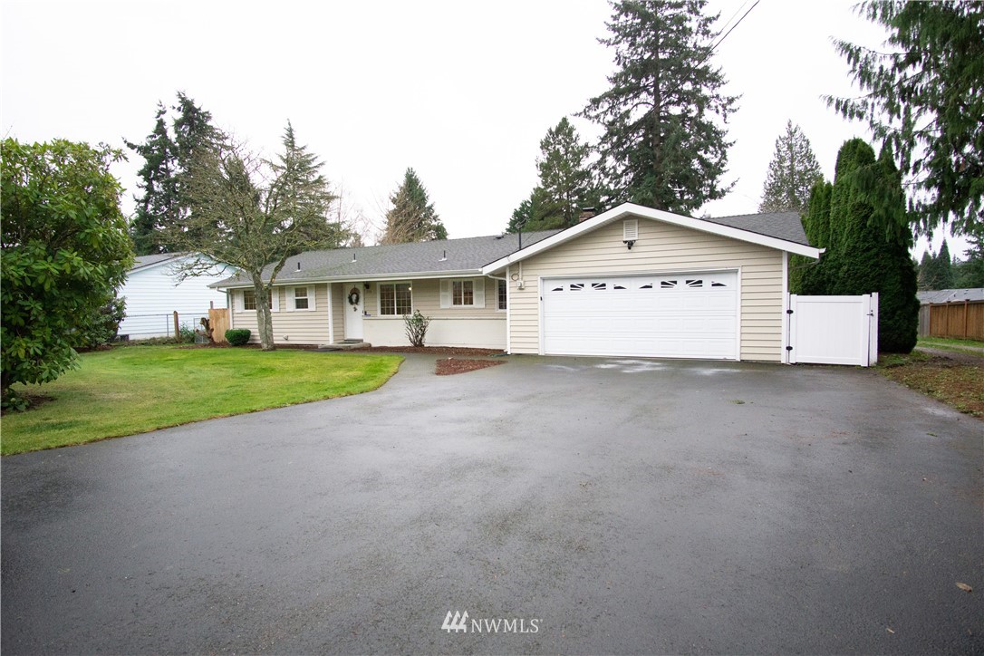 306 216th Street Southwest Bothell, WA 98021 - Photo 23 of 31 a view of an house with backyard and tree