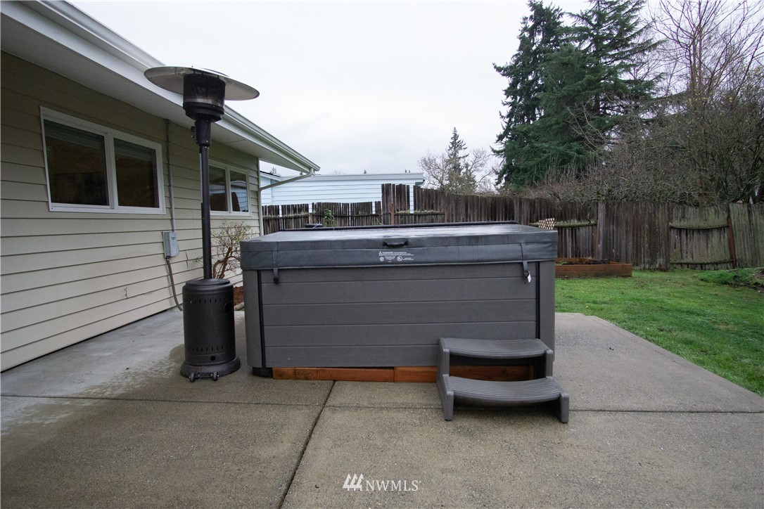 306 216th Street Southwest Bothell, WA 98021 - Photo 25 of 31 a view of a patio with table and chairs with wooden fence