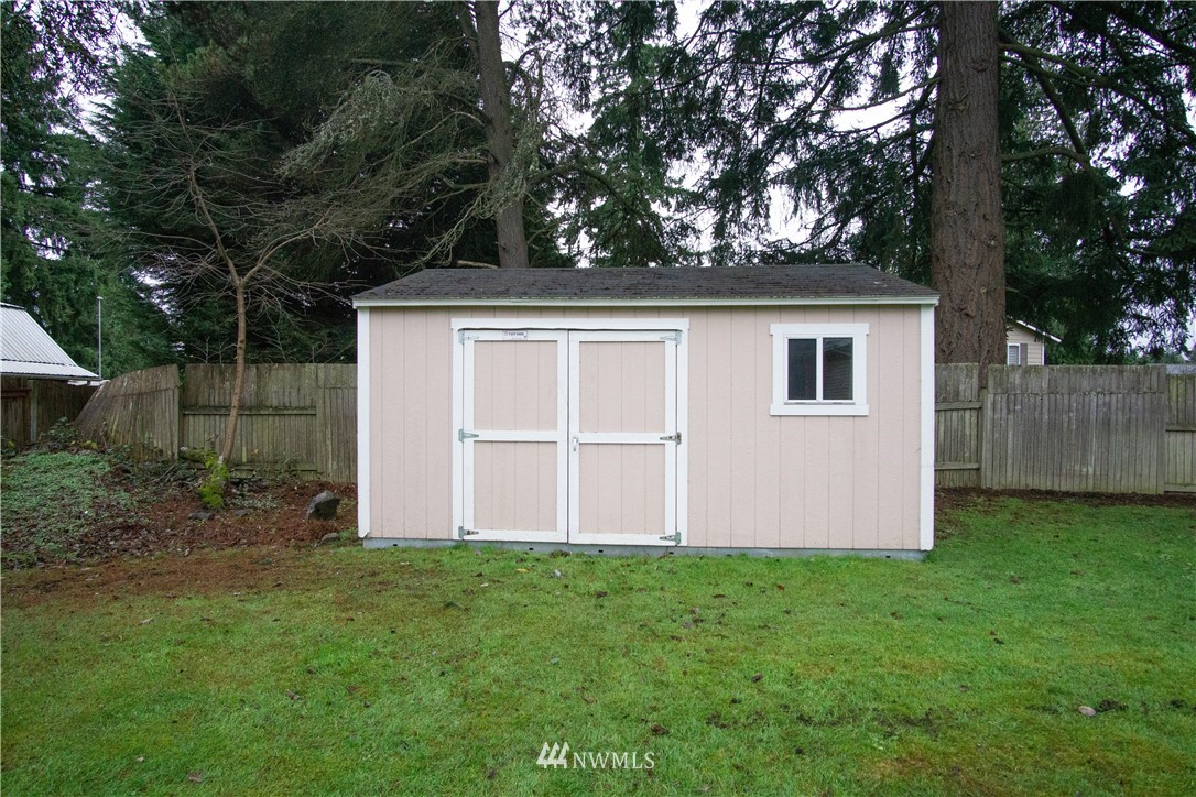 306 216th Street Southwest Bothell, WA 98021 - Photo 29 of 31 a view of backyard with garden and tall trees