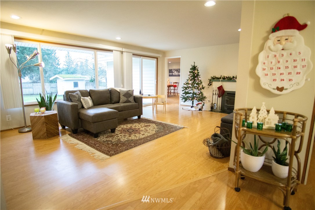 306 216th Street Southwest Bothell, WA 98021 - Photo 8 of 31 a living room with furniture and a large window