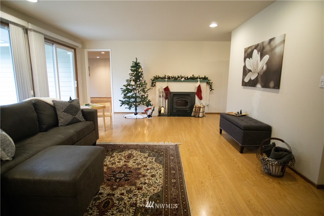 306 216th Street Southwest Bothell, WA 98021 - Photo 9 of 31 a living room with furniture and a fireplace