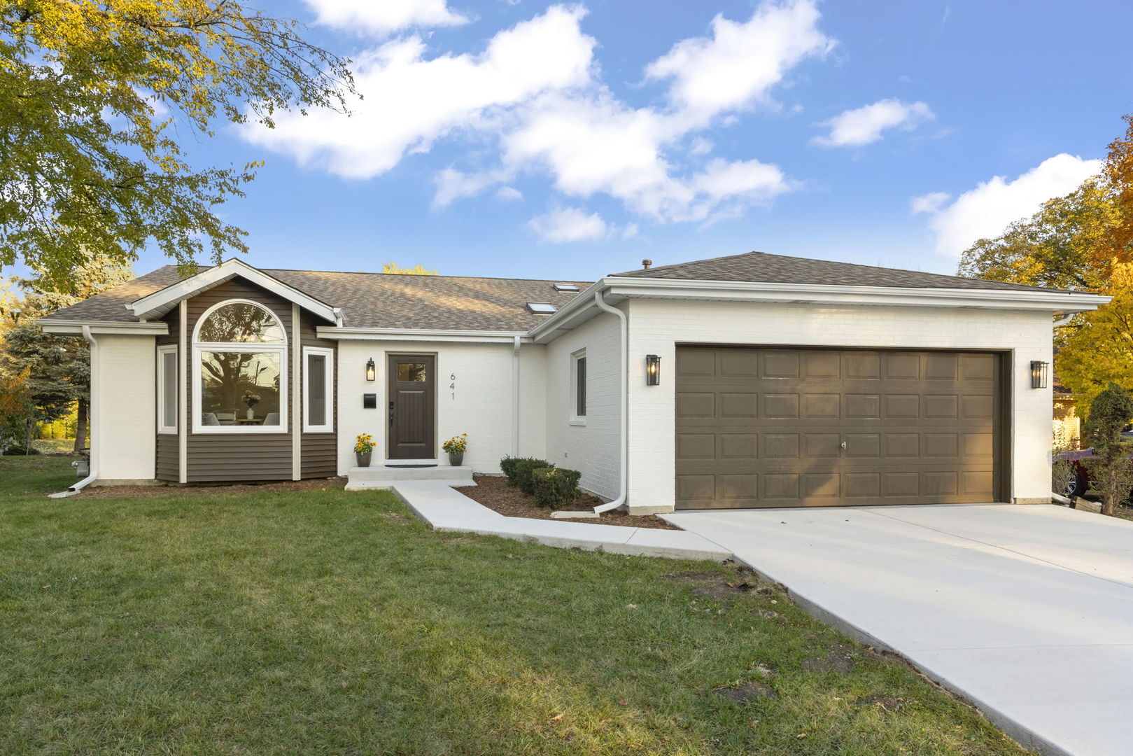 641 Highview Avenue Addison, IL 60101 - Photo 1 of 36 a front view of a house with a yard and garage