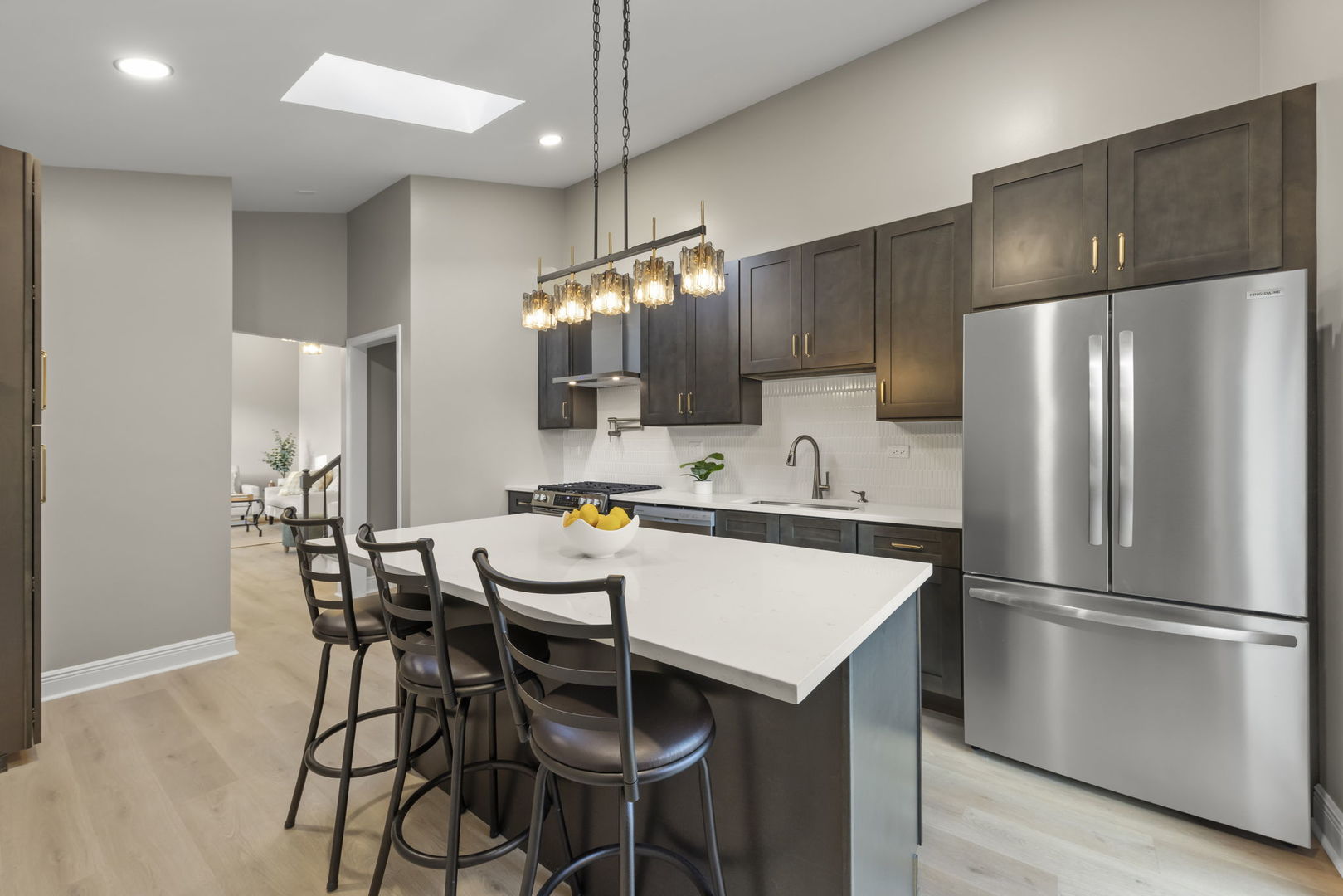 641 Highview Avenue Addison, IL 60101 - Photo 5 of 36 a kitchen with a refrigerator a dining table and chairs