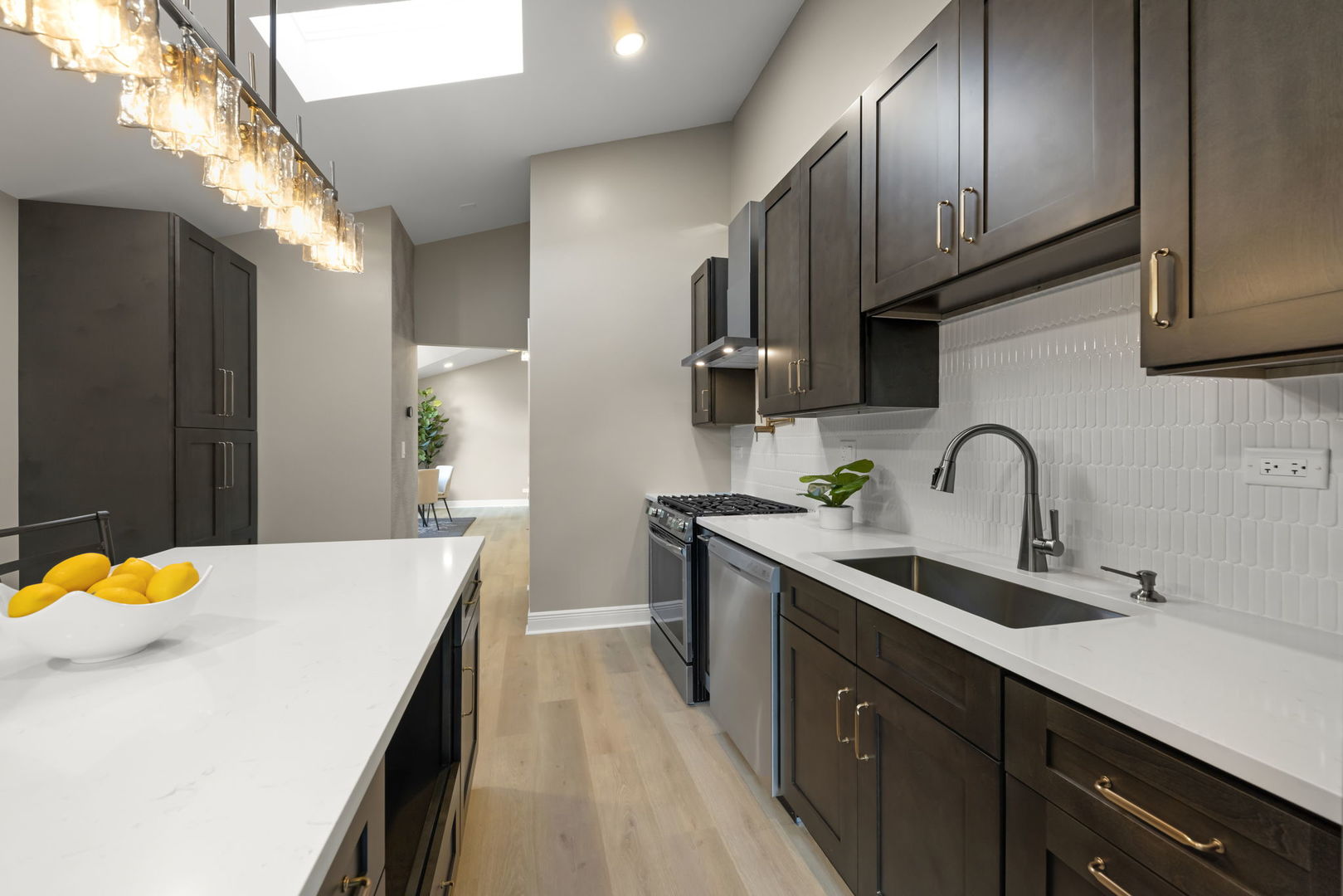 641 Highview Avenue Addison, IL 60101 - Photo 8 of 36 a kitchen with stainless steel appliances a sink stove and cabinets