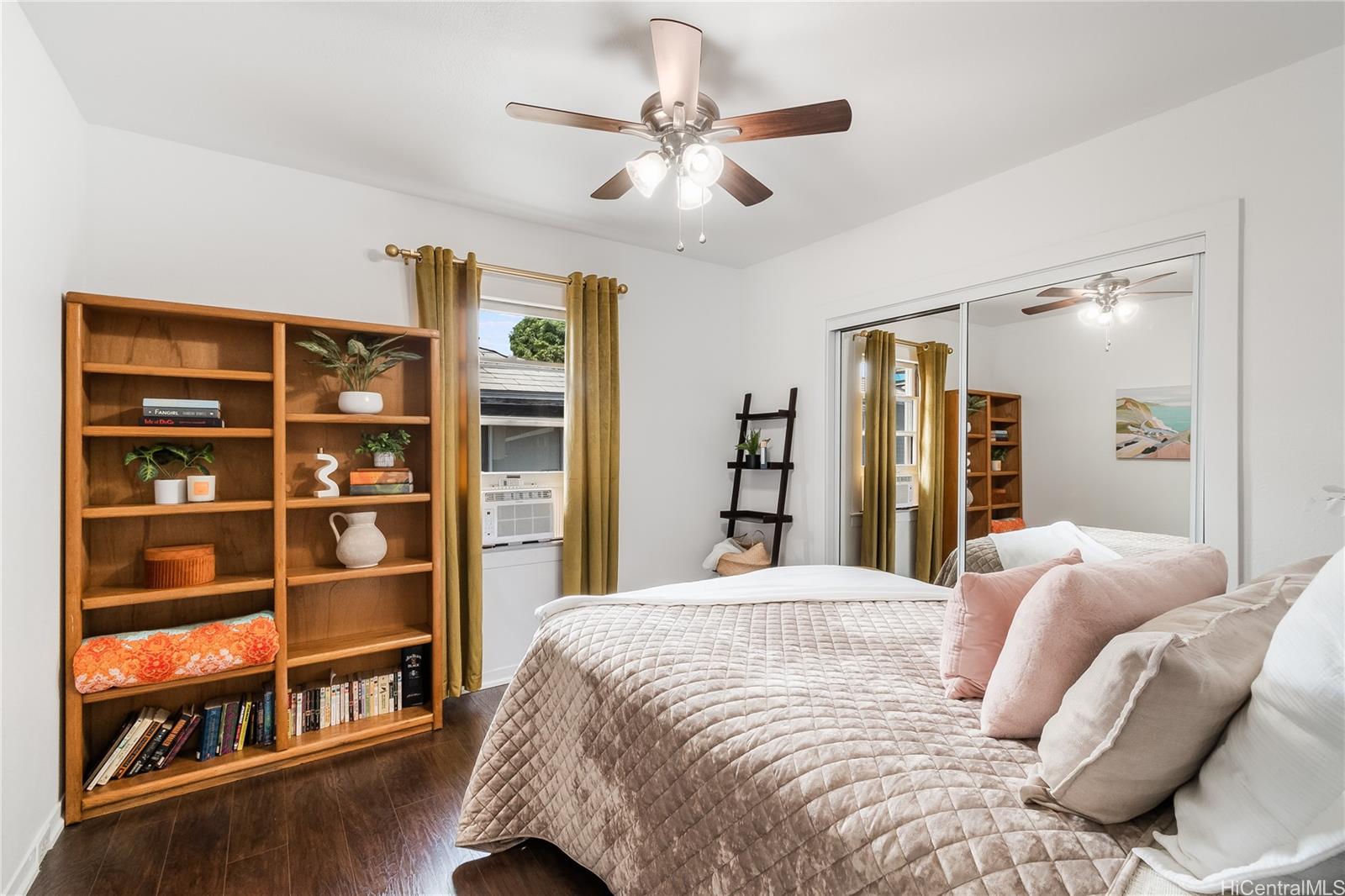 1506 Frear Street, Unit A Honolulu, HI 96813 - Photo 10 of 19 a bedroom with a large bed and a chandelier