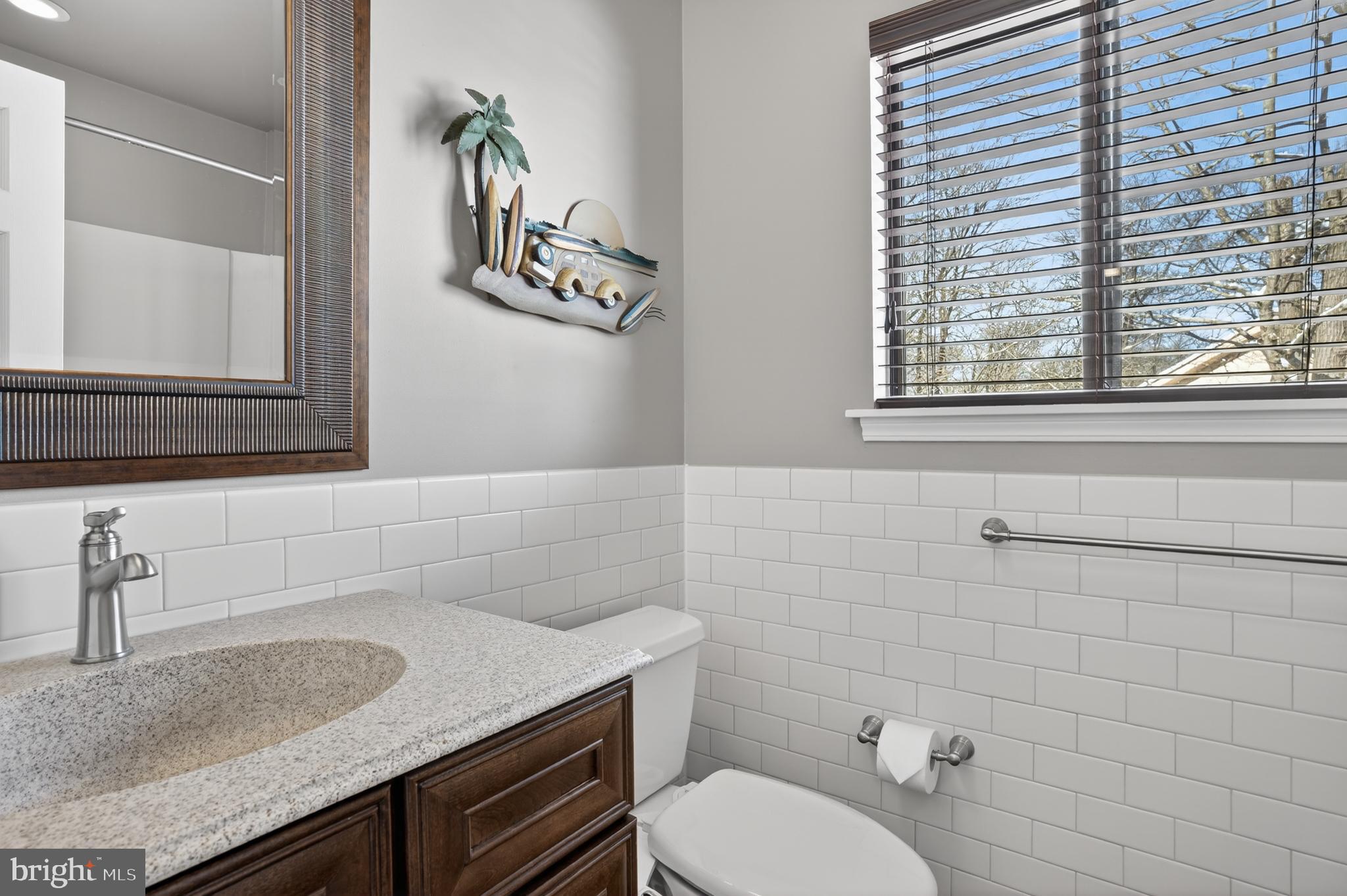1104 Brinton Place Road, Unit 19 West Chester, PA 19380 - Photo 21 of 32 a bathroom with a granite countertop sink and a toilet