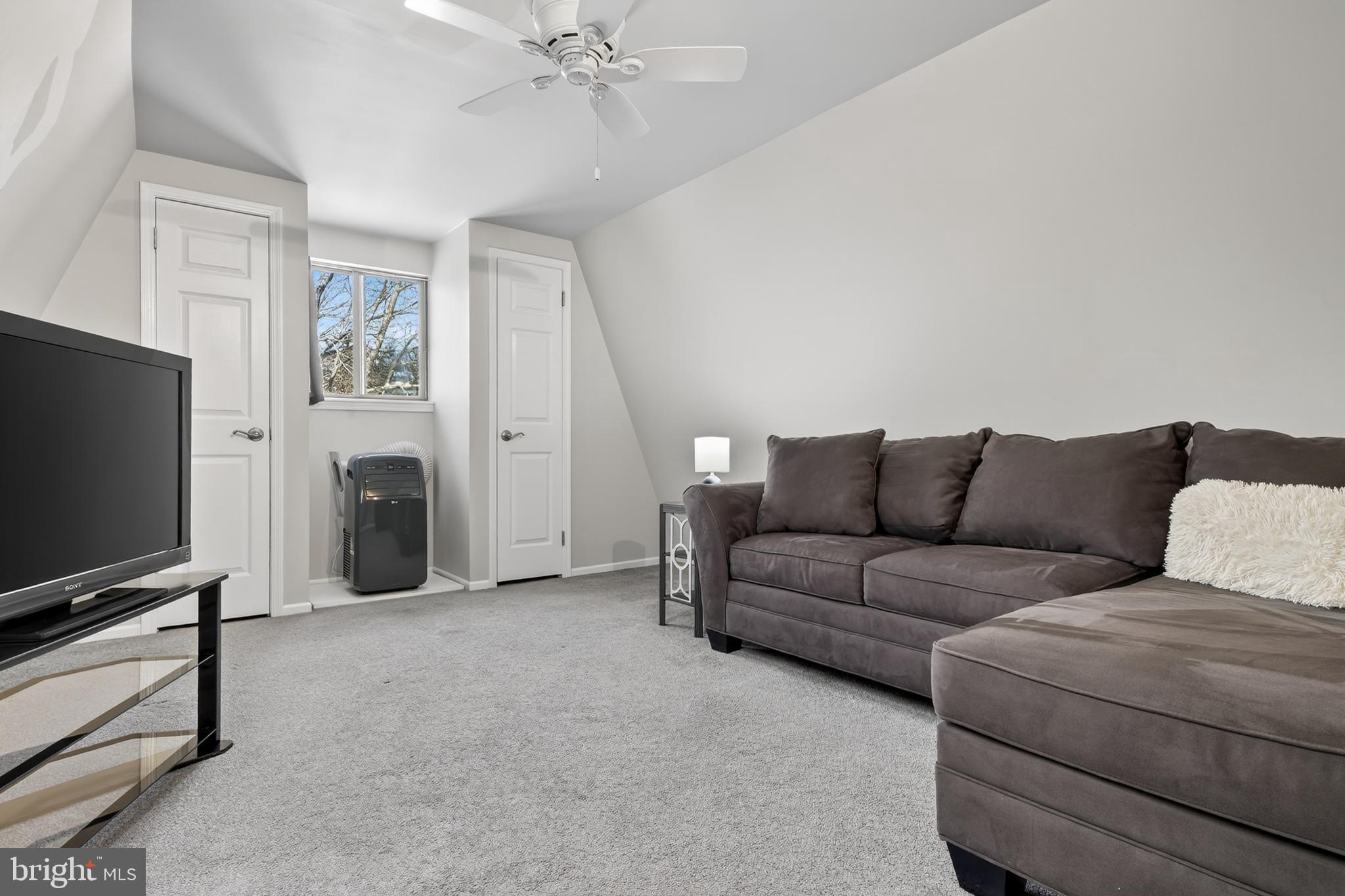 1104 Brinton Place Road, Unit 19 West Chester, PA 19380 - Photo 26 of 32 a living room with furniture and a flat screen tv