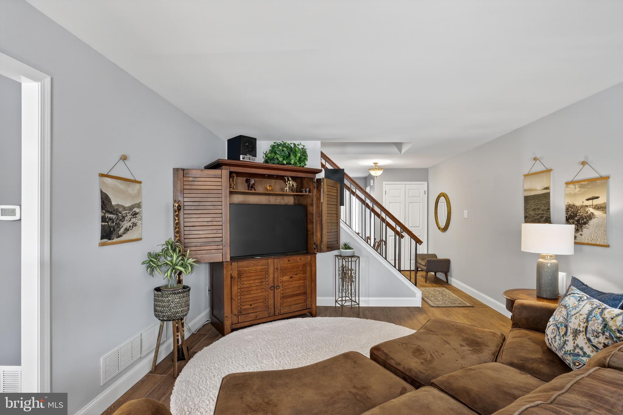 1104 Brinton Place Road, Unit 19 West Chester, PA 19380 - Photo 3 of 32 a living room with furniture stairs and a potted plant