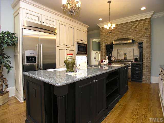 11308 Royal Amber Way Raleigh, NC 27614 - Photo 3 of 12 a kitchen with stainless steel appliances granite countertop a sink a counter top space and cabinets