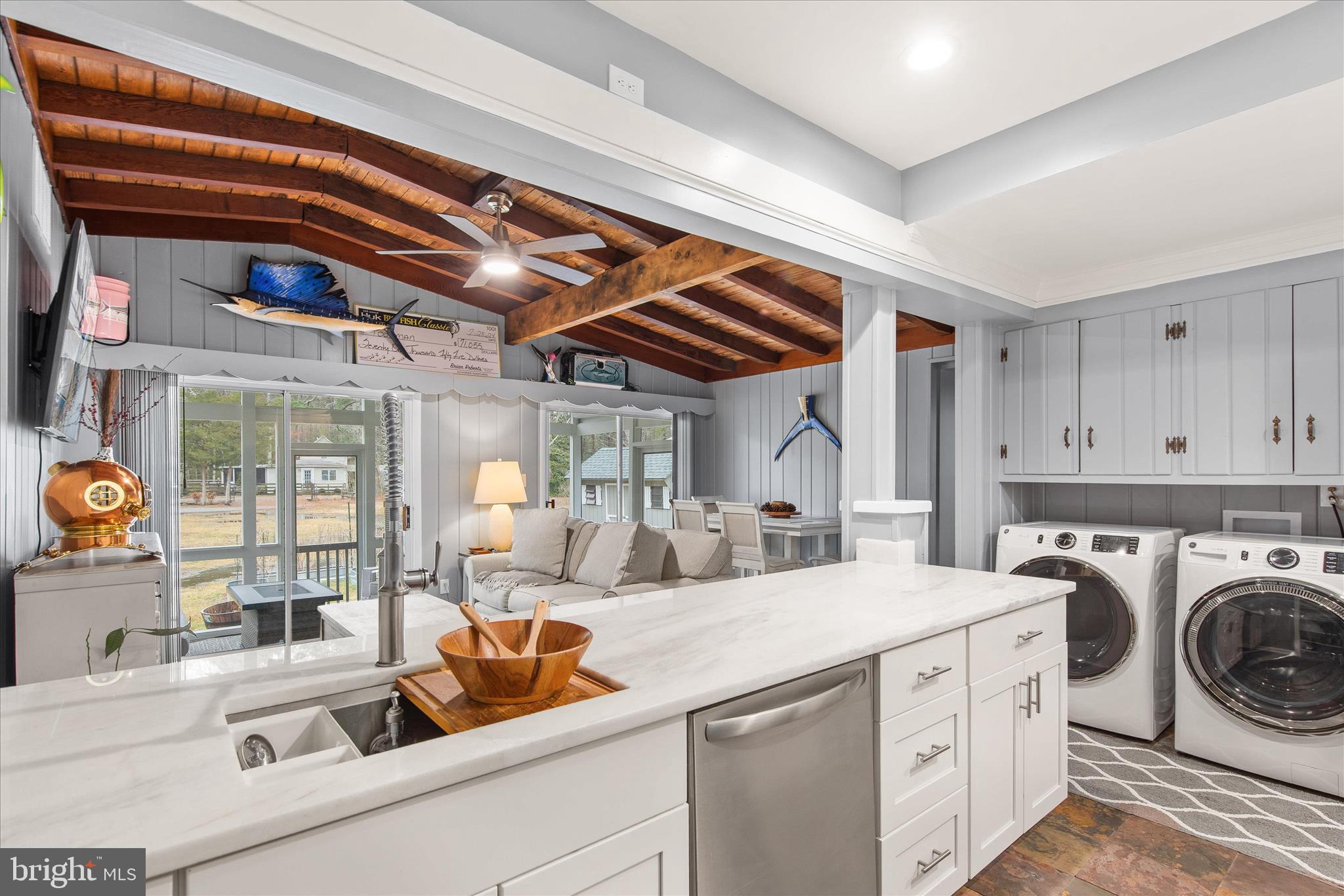 12107 Angler Road Ocean City, MD 21842 - Photo 18 of 106 a utility room with sink dryer and washer