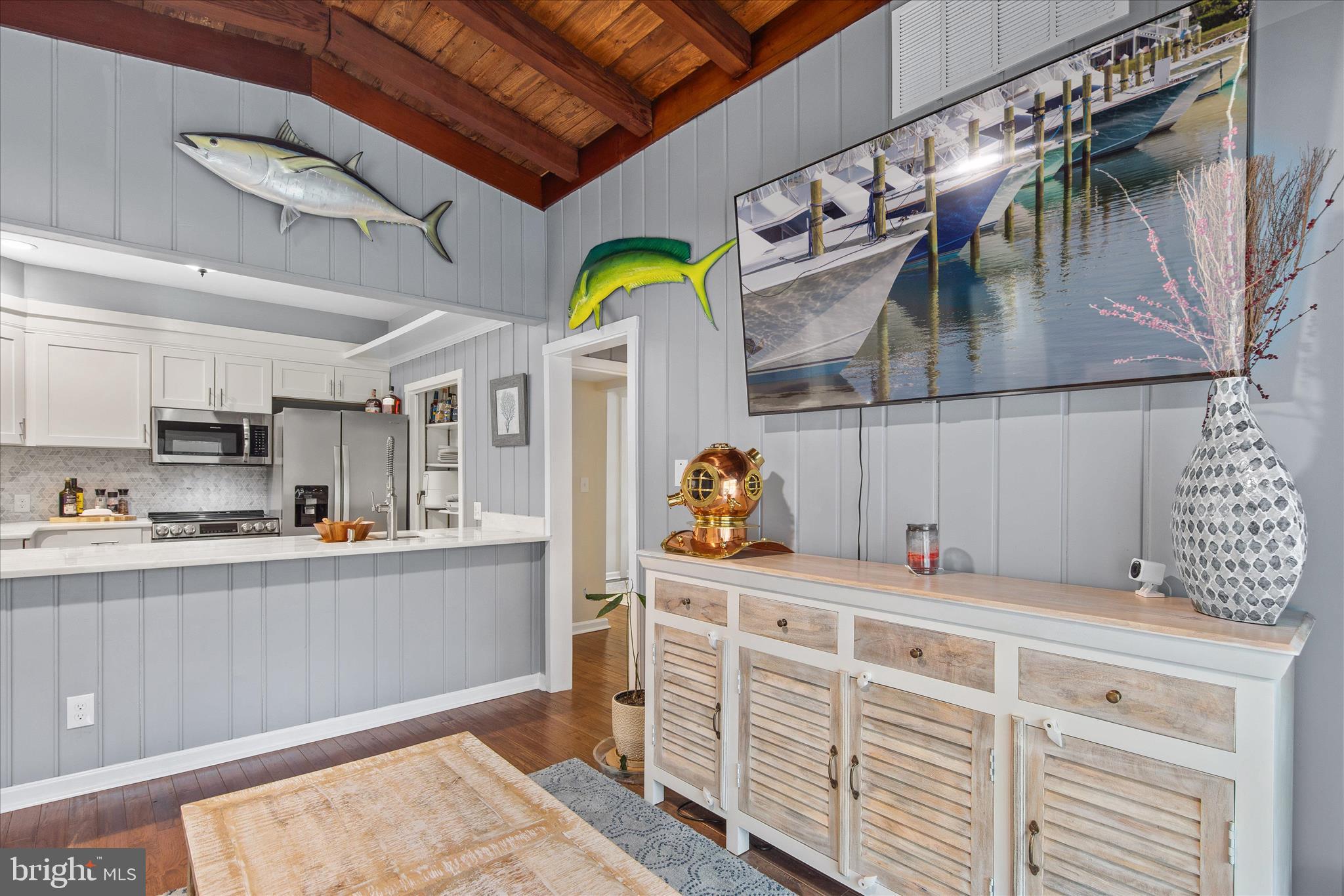 12107 Angler Road Ocean City, MD 21842 - Photo 26 of 106 a kitchen with stainless steel appliances kitchen island granite countertop a sink and cabinets